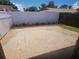 Fenced-in backyard featuring a large brick paver patio and a flower bed at 209 Corkwood Ln Ln, Oldsmar, FL 34677