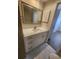 Bathroom vanity featuring white cabinetry, granite countertop, and tile floors at 209 Corkwood Ln Ln, Oldsmar, FL 34677