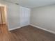 Bedroom with wood-look flooring, closet, and neutral walls at 209 Corkwood Ln Ln, Oldsmar, FL 34677