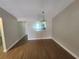 Bright dining room featuring wood floors and a modern chandelier at 209 Corkwood Ln Ln, Oldsmar, FL 34677