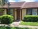Cozy townhouse featuring manicured landscaping and a welcoming front entrance at 209 Corkwood Ln Ln, Oldsmar, FL 34677