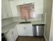 Modern kitchen with stainless steel appliances and white cabinetry at 209 Corkwood Ln Ln, Oldsmar, FL 34677