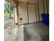 Garage area featuring access door and adjacent exterior wall at 209 Corkwood Ln, Oldsmar, FL 34677