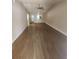 Open living room with wood floors and natural light at 209 Corkwood Ln, Oldsmar, FL 34677