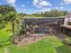 An aerial view of the property reveals a pool, landscaped backyard, and mature trees at 2103 N Golfview Dr, Plant City, FL 33566