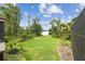Expansive backyard with well-maintained lawn leading to the water at 2103 N Golfview Dr, Plant City, FL 33566