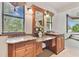 Vanity in bathroom featuring granite counters and a beautiful green landscape view at 2103 N Golfview Dr, Plant City, FL 33566
