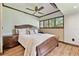 Comfortable bedroom with hardwood floors, plantation shutters and neutral decor at 2103 N Golfview Dr, Plant City, FL 33566