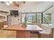 Eat-in kitchen with a built-in booth and views of the screened in pool and waterfall at 2103 N Golfview Dr, Plant City, FL 33566