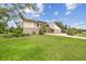 Beautiful home exterior with manicured lawn and stone accents, showcasing curb appeal at 2103 N Golfview Dr, Plant City, FL 33566