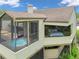 Exterior view of the property featuring a hot tub, bedroom, and beautiful landscaping at 2103 N Golfview Dr, Plant City, FL 33566