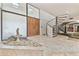 Elegant foyer with a grand spiral staircase, marble flooring, and a decorative fountain feature at 2103 N Golfview Dr, Plant City, FL 33566