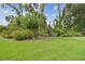 Beautiful gardens featuring diverse greenery and colorful flower accents at 2103 N Golfview Dr, Plant City, FL 33566