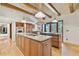 Gourmet kitchen boasts granite countertops, stainless steel appliances, custom cabinets, and a large island at 2103 N Golfview Dr, Plant City, FL 33566