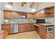 Well-equipped kitchen with custom cabinets, granite countertops, and stainless steel appliances at 2103 N Golfview Dr, Plant City, FL 33566