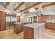 Well-equipped kitchen with stainless steel appliances, granite countertops, and wood cabinets at 2103 N Golfview Dr, Plant City, FL 33566