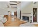 Spacious living room featuring a fireplace, open floor plan and wood floors at 2103 N Golfview Dr, Plant City, FL 33566