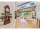 Bright and open living room with hardwood floors, a wall of windows, and stylish furnishings at 2103 N Golfview Dr, Plant City, FL 33566