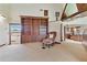 Spacious living room with built-in wooden shelving and a comfortable reading nook at 2103 N Golfview Dr, Plant City, FL 33566