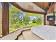 Bedroom featuring a large window overlooking a lush yard at 2103 N Golfview Dr, Plant City, FL 33566