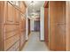 Spacious walk-in closet featuring custom wooden cabinetry, drawers, and shelving for optimal storage solutions at 2103 N Golfview Dr, Plant City, FL 33566