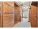 Large walk-in closet with custom-built wooden storage, multiple drawers, and hanging racks for organized clothing at 2103 N Golfview Dr, Plant City, FL 33566