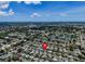 Wide aerial shot of a neighborhood, highlighting the property's setting and surroundings at 2115 Erin Dr, Holiday, FL 34690