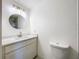 Bathroom with new vanity with sink, lighting, mirror and tile flooring at 2115 Erin Dr, Holiday, FL 34690