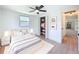 Bedroom with a ceiling fan, a bed with a white rug, and a closet at 2115 Erin Dr, Holiday, FL 34690