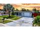 Charming single-story home with well-maintained lawn and mature palm tree at 2115 Erin Dr, Holiday, FL 34690
