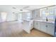 Bright kitchen featuring stainless appliances, modern cabinets, and bar seating at 2115 Erin Dr, Holiday, FL 34690