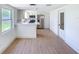 Bright kitchen featuring stainless appliances, modern cabinets, and bar seating at 2115 Erin Dr, Holiday, FL 34690
