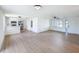 Open-concept living space with kitchen bar and dining area, creating a cohesive and inviting atmosphere at 2115 Erin Dr, Holiday, FL 34690