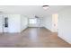 Bright and airy living space with laminate floors and white walls, offering versatility and a blank canvas at 2115 Erin Dr, Holiday, FL 34690