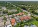An aerial perspective featuring a neighborhood with mature landscaping close to a highway at 2228 Hannah S Way, Dunedin, FL 34698