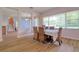 Light-filled dining room features a large window and stylish furniture at 2228 Hannah S Way, Dunedin, FL 34698