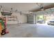 Well-lit two-car garage with easy access and ample space for parking vehicles and storage at 2228 Hannah S Way, Dunedin, FL 34698