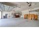 Spacious two-car garage with overhead storage racks and ample room for parking and projects at 2228 Hannah S Way, Dunedin, FL 34698