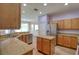 Kitchen with stainless steel appliances, granite countertops, and wood cabinets at 2228 Hannah S Way, Dunedin, FL 34698