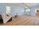 Light-filled living room with laminate flooring and windows for natural light at 2228 Hannah S Way, Dunedin, FL 34698