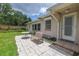 Cozy patio with seating area, surrounded by lush greenery in a well-kept backyard at 2415 York N St, St Petersburg, FL 33710