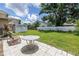 Large backyard with a shed, patio area, and lush green lawn at 2415 York N St, St Petersburg, FL 33710