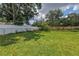 A large backyard showcasing well-maintained lawn and secure fencing at 2415 York N St, St Petersburg, FL 33710