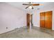 Bedroom featuring terrazzo flooring, ceiling fan, and a closet at 2415 York N St, St Petersburg, FL 33710