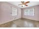 Bright bedroom featuring two windows offering ample natural light and a ceiling fan at 2415 York N St, St Petersburg, FL 33710