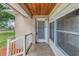 View of the front door of the house from the front porch with tiled floors at 2415 York N St, St Petersburg, FL 33710