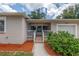 Cozy front porch with tiled steps and a white railing leading to the entrance at 2415 York N St, St Petersburg, FL 33710