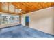Inviting living room with a wooden ceiling, a ceiling fan, and large windows at 2415 York N St, St Petersburg, FL 33710