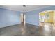 Bright living room featuring polished terrazzo floors and blue accent walls at 2415 York N St, St Petersburg, FL 33710