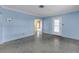 Bright living room featuring polished terrazzo floors and blue accent walls at 2415 York N St, St Petersburg, FL 33710